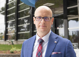 ATA president standing infront of the Association building