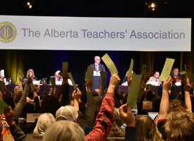 ARA attendees hold up voting signs