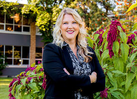 Principal Jillian Marino in front of her school