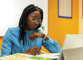 A woman working on a laptop