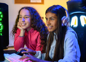 Two students play a video game