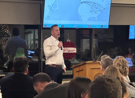 A presenter speaks at the leadership series