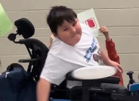 A student throws a frisbee achieving a world record