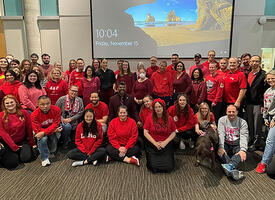 A group of teachers wearing red clothing