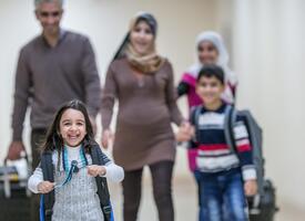 Multi generational family behind their young excited daughter 