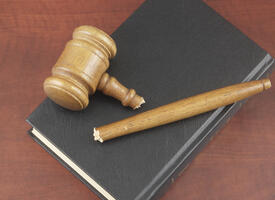 broken gavel on top of a book