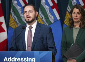 Alberta's premier and minister of Education and Childcare at a press conference