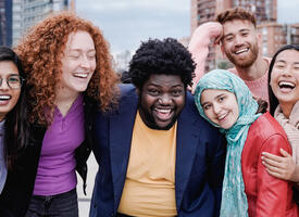 Group huddled outside smiling