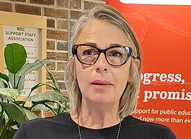 A teacher creates a video testimonial during a conference