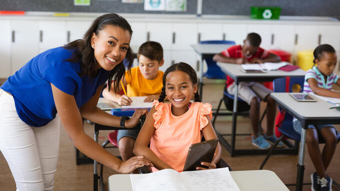 Female teacher with student in wheelchair