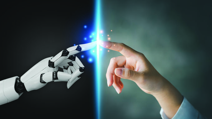 Robotic and human hands touch