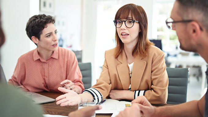 Women speaking up at meeting