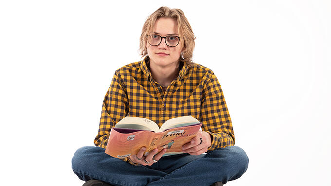Young adult with an open book