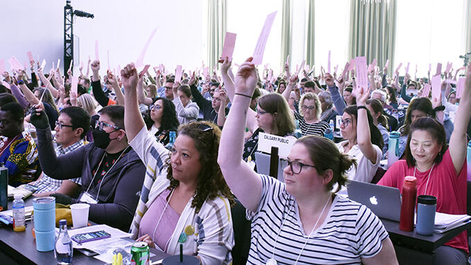 Delegates vote on a resolution at the ARA