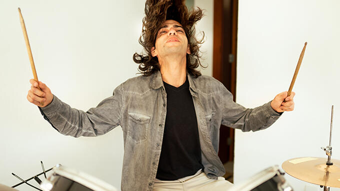 A long-haired drummer