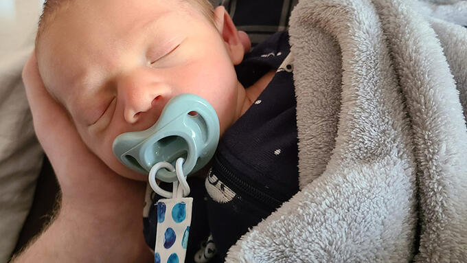 A sleeping newborn baby