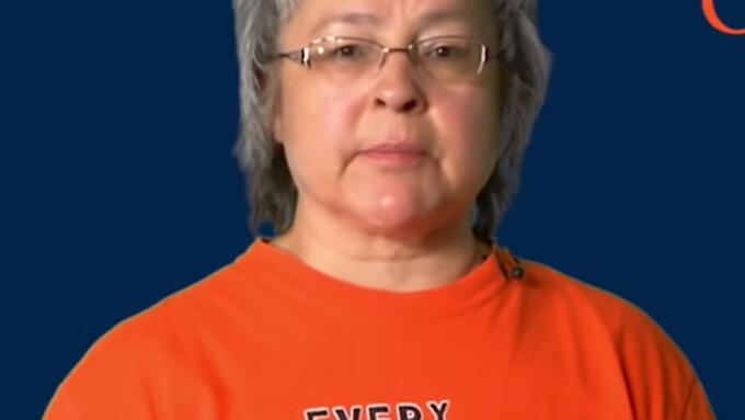 Woman wearing an orange shirt