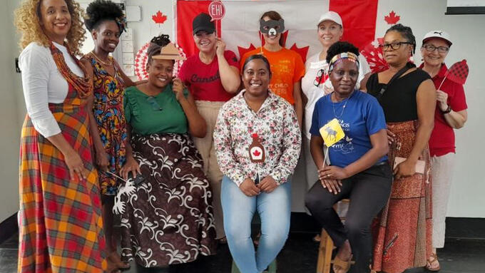 Participants from Canada and St. Lucia come together to share about their respective countries on Cultural Day.