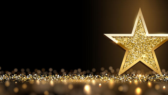 A gold star on a dark background