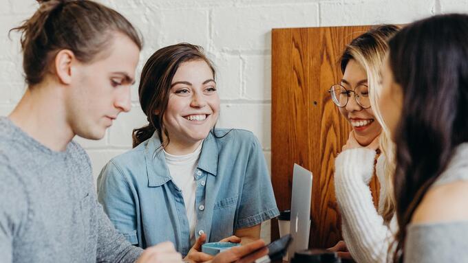 Four young teachers chatting
