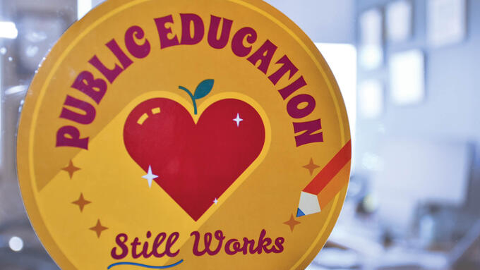 Public education sticker adhered to an office window