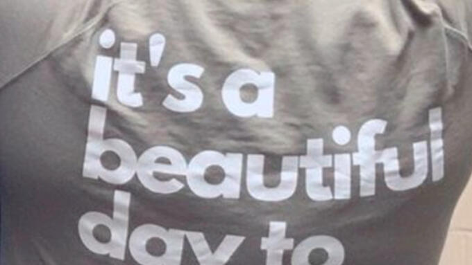 A person's back with text on a shirt that reads, "It's a beautiful day to teach humans."