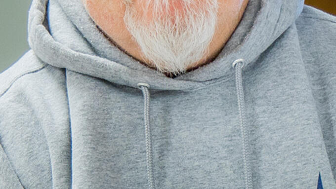 A white man with glasses and a gray mustache and goatee