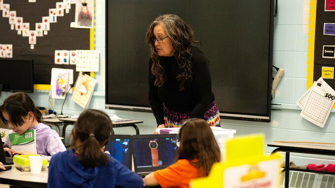 Female teacher at front of the classroom