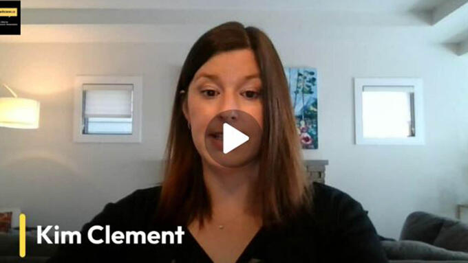 Still from a video testimonial made by a women with brown hair