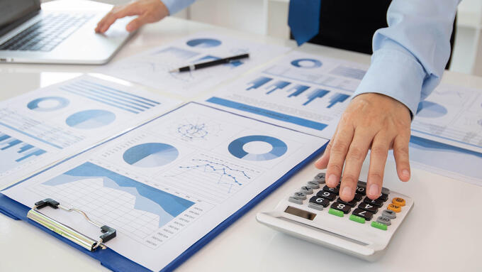 Desk filled with paper graphs