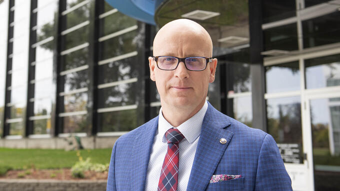 ATA president standing infront of the Association building
