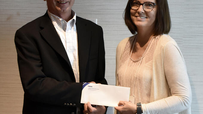 Lisa Fletcher accepts a draw prize