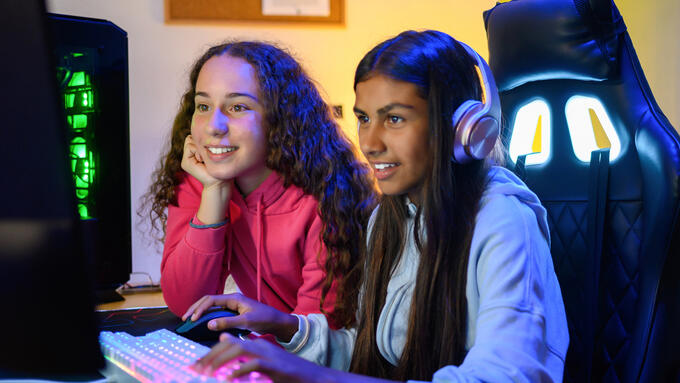 Two students play a video game
