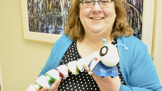 Woman holding plastic toy
