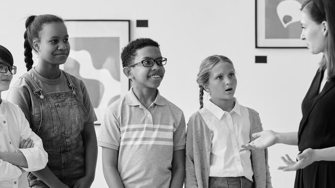 Counsellor speaking to four students