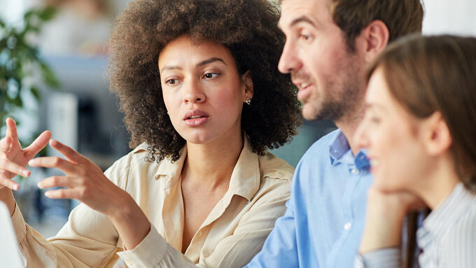 Group discussing over laptop