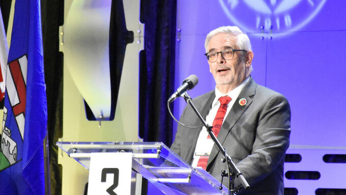 ATA Executive secretary speaks at a podium