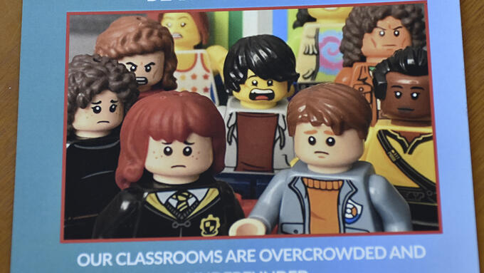 Event postcard with angry Lego people