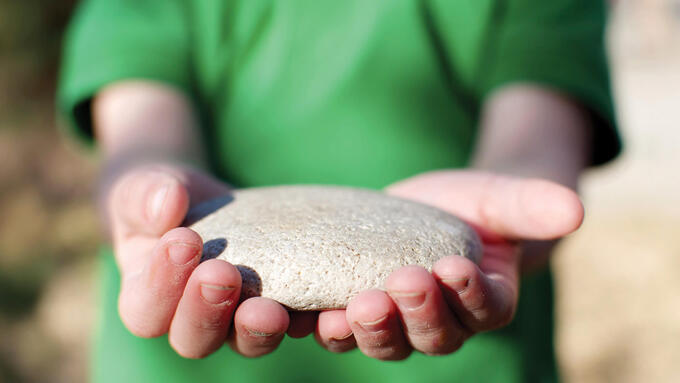 Small boy holding a fish