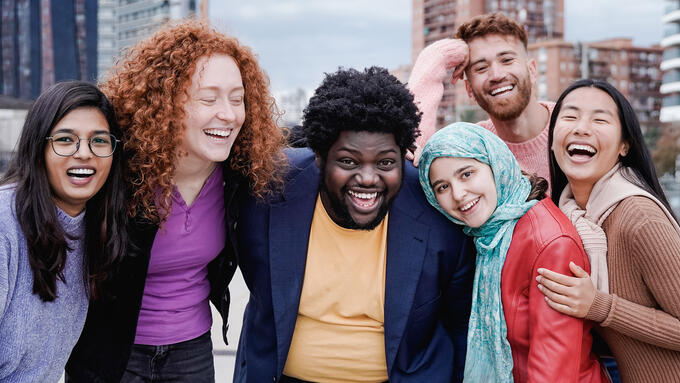 Group huddled outside smiling