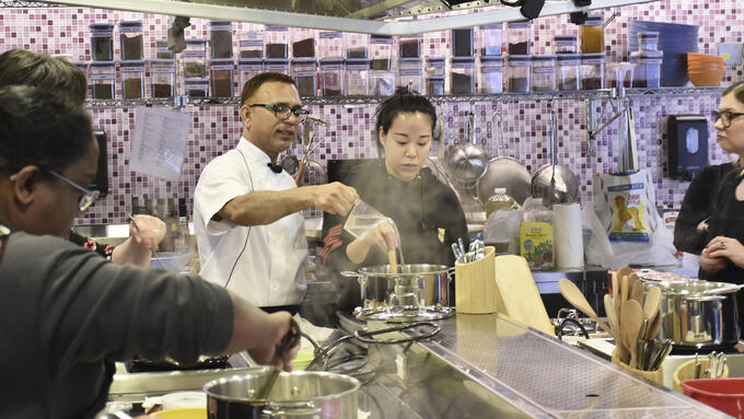 GETCA attendees participate in a cooking class