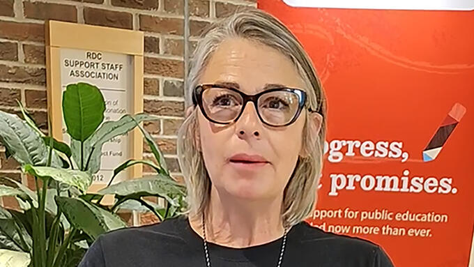 A teacher creates a video testimonial during a conference