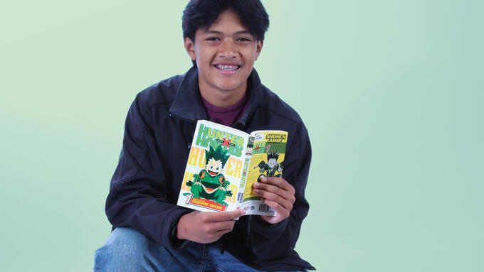 Young man holding a book Hunter Hunter