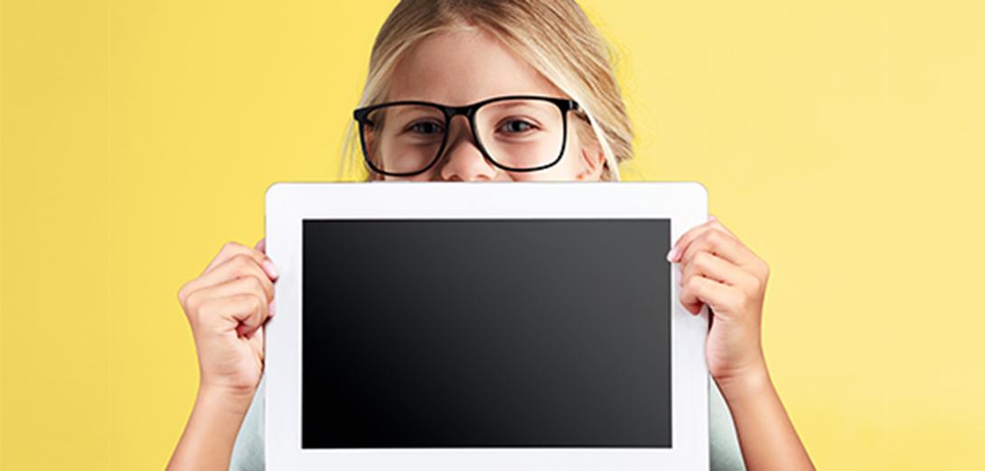 young girl wearing large black glasses holding a tablet over half of her page