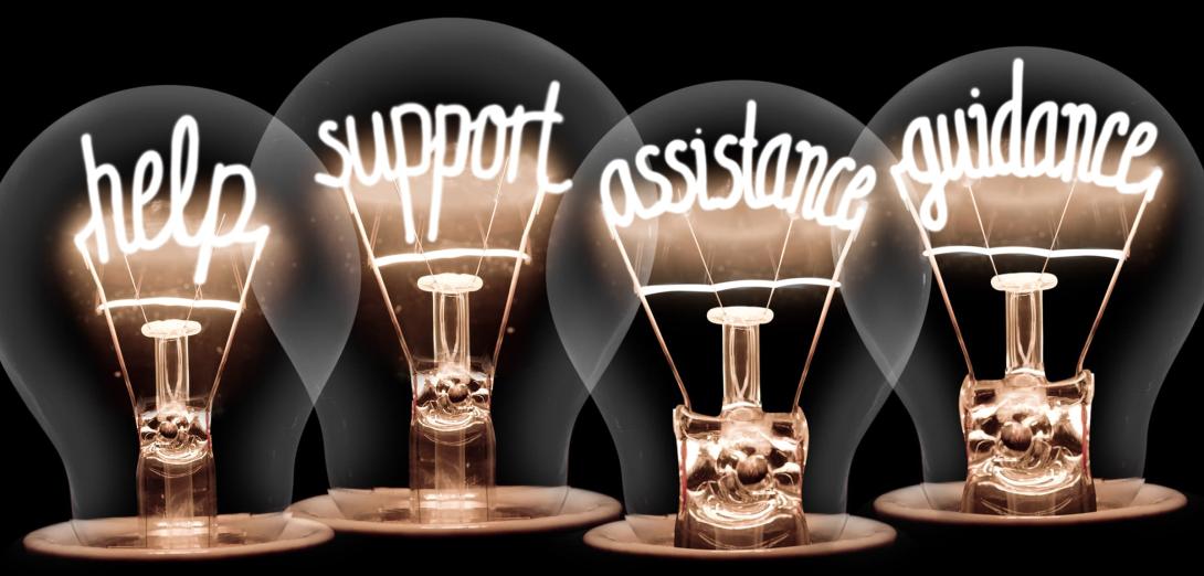 Lightbulbs with the words Help, support , assistance and guidance written in the filaments