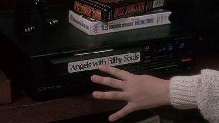 Screenshot from movie Home Alone where Kevin inserts VHS tape titled Angels
