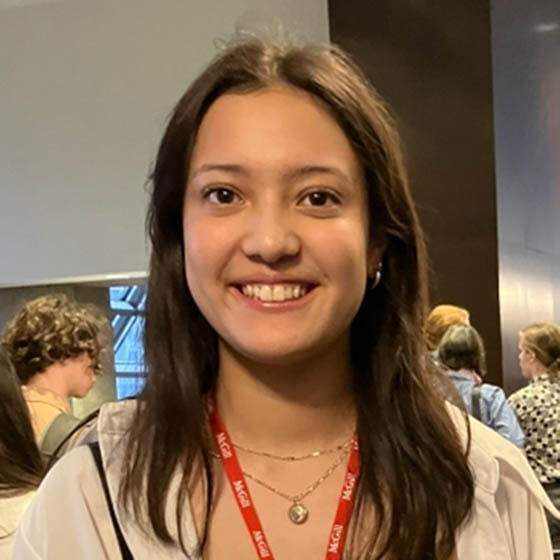 Young women with red lanyard smiling