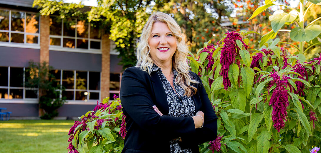 Principal Jillian Marino in front of her school