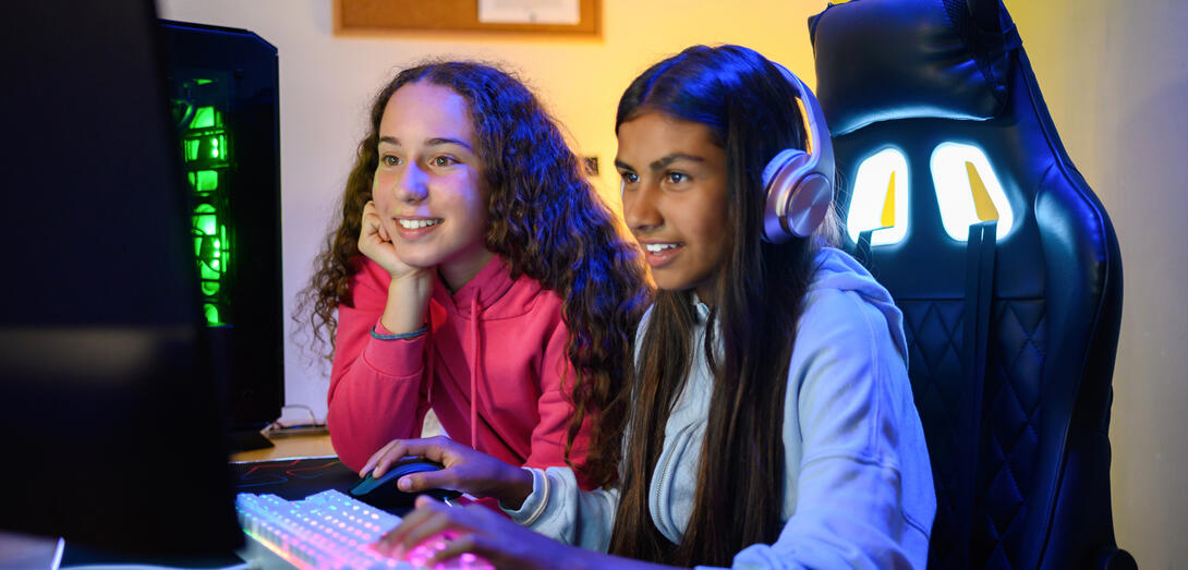 Two students play a video game