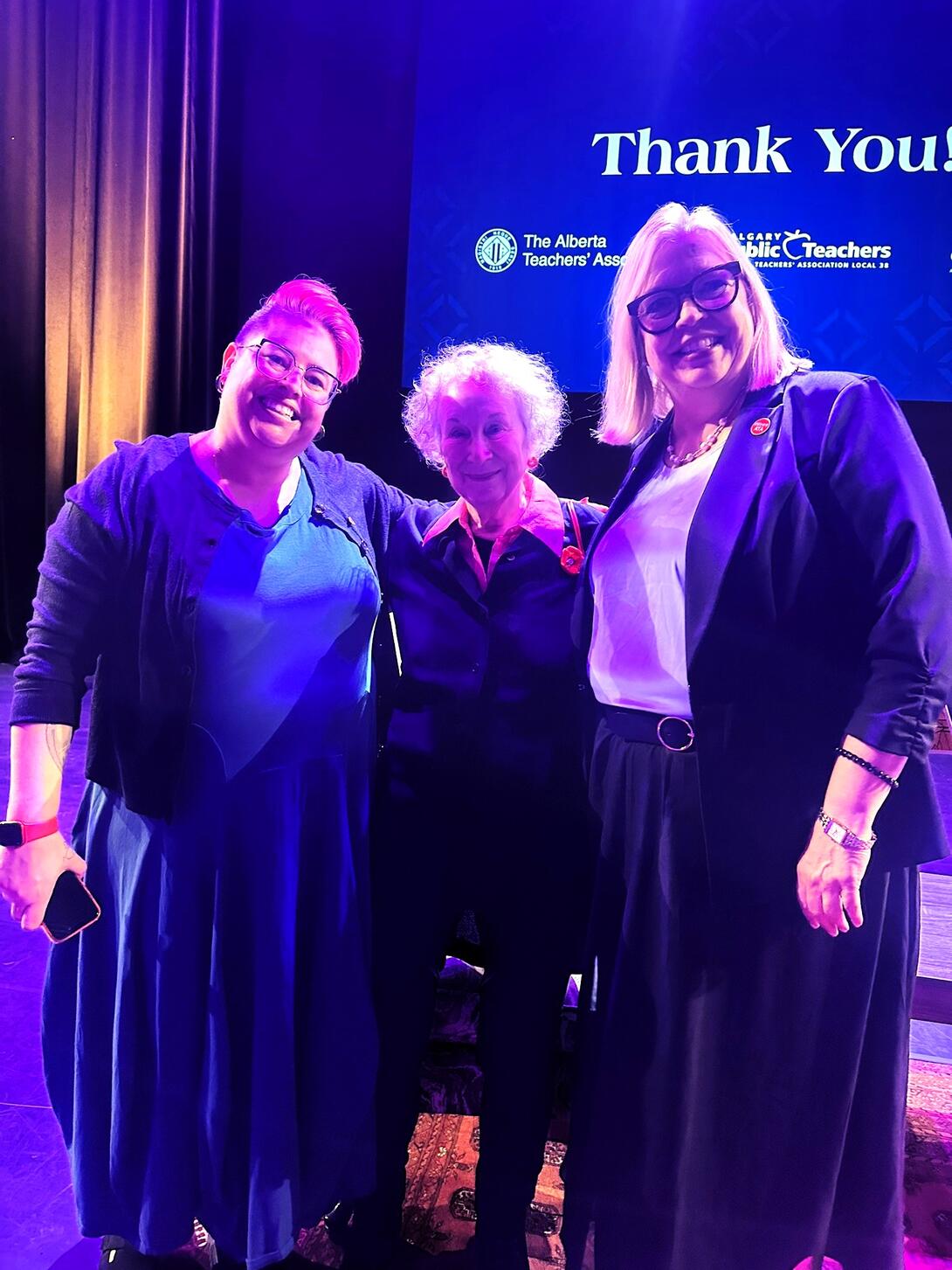 Margaret Atwood posing with fans.